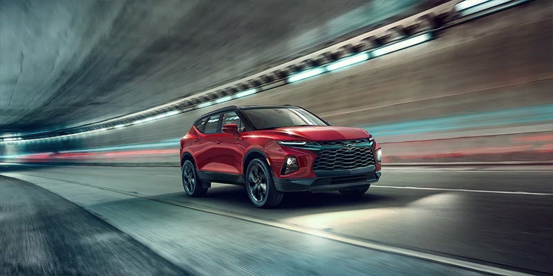 Wide shot of 2022 Chevy Blazer driving in a city tunnel