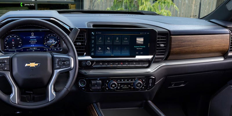 Close up view of Chevrolet Silverado 2500 dash with steering wheel and touch screen navigation