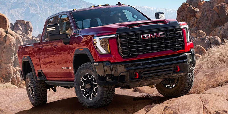Right side view of 2025 GMC Sierra 2500 parked on a mountain top